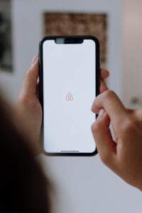 phone with airbnb app for hosts