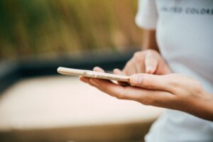 Person using their phone to automate their airbnb business